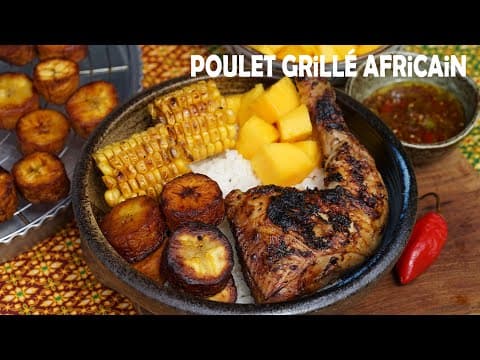 Poulet grillé africain avec riz, plantain frit, maïs grillé et mangue