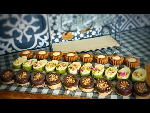 Assortment of pistachio and hazelnut chocolates and speculoos biscuits